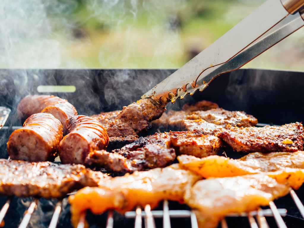 A close up of someone grilling.